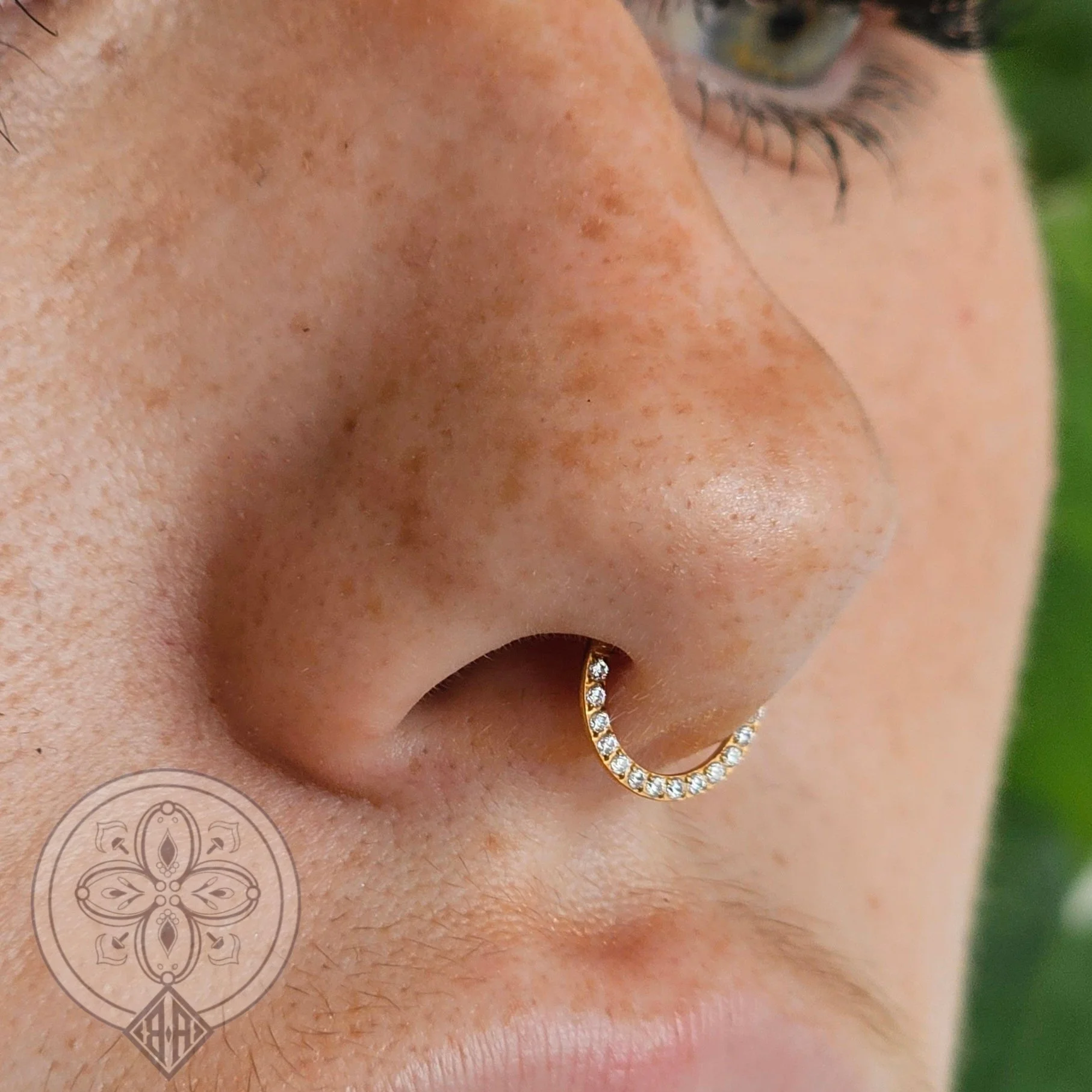 Septum Piercing with gold jewellery 