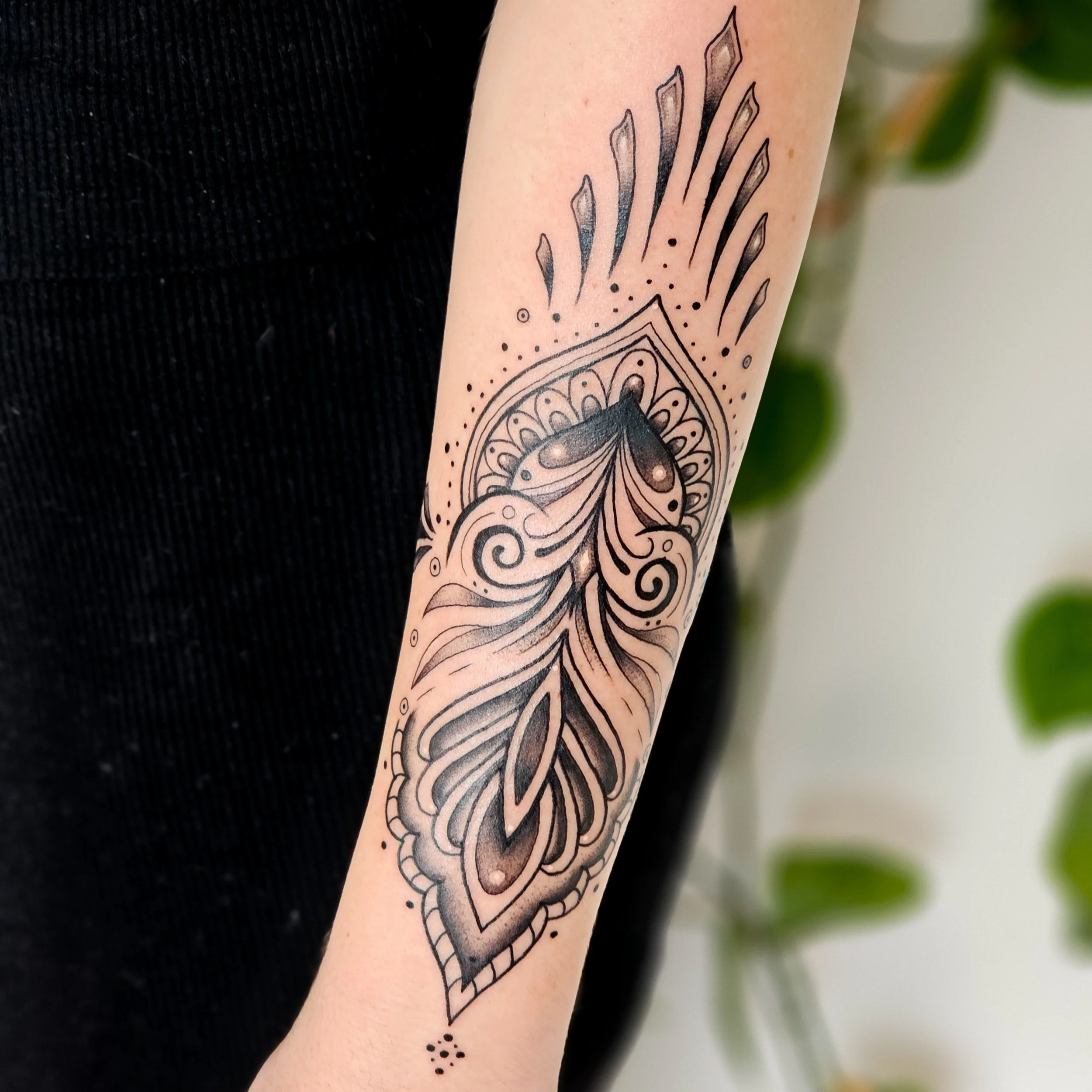 Ornamental forearm tattoo 