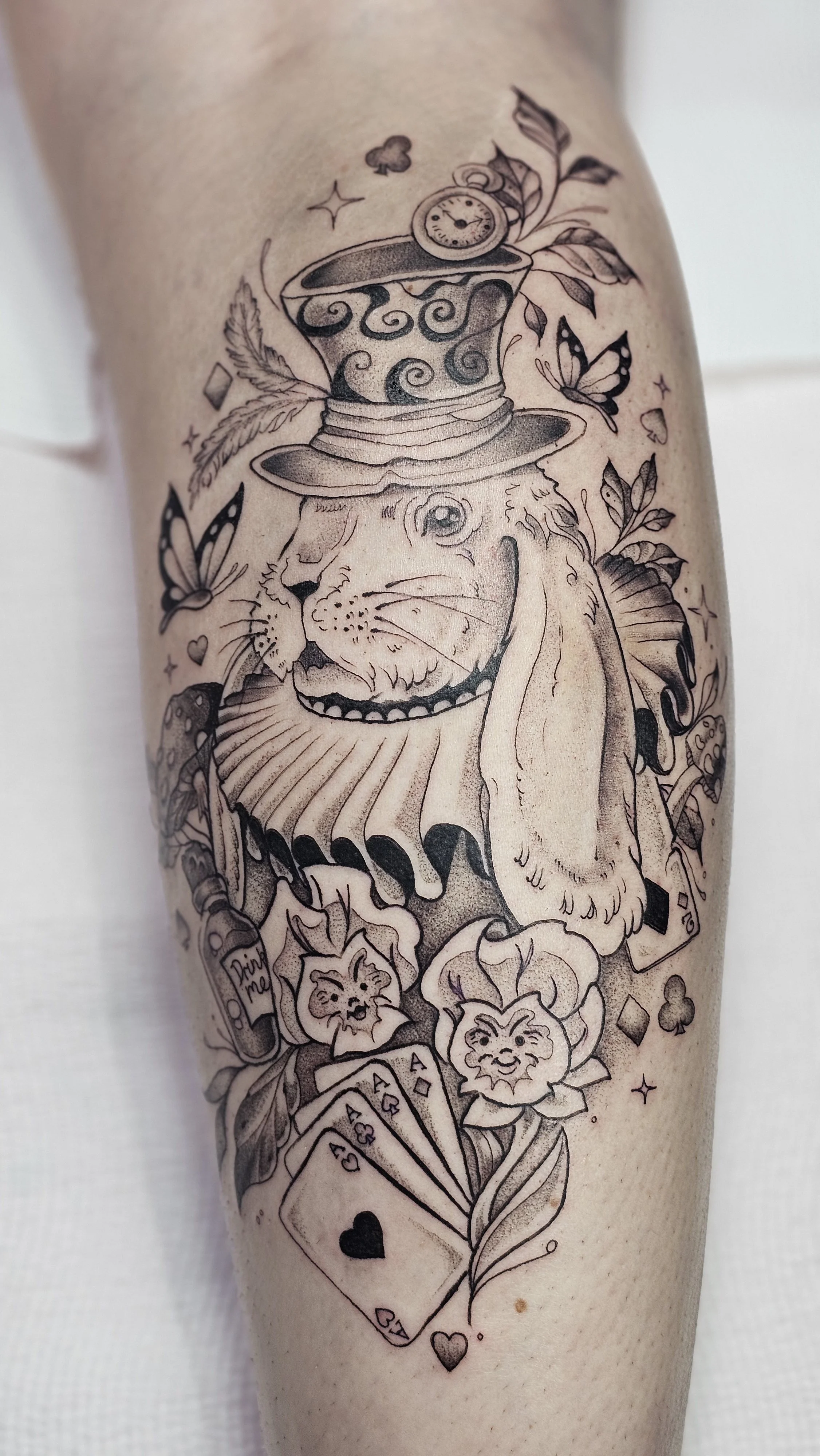 Alice in Wonderland calf tattoo