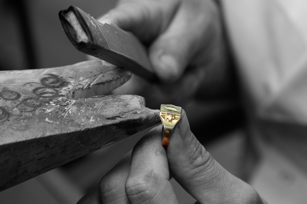 jeweller at the bench working on a ring