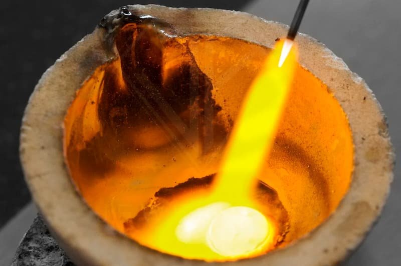 melting metal to make a shank on a diploma jewellery courses uk