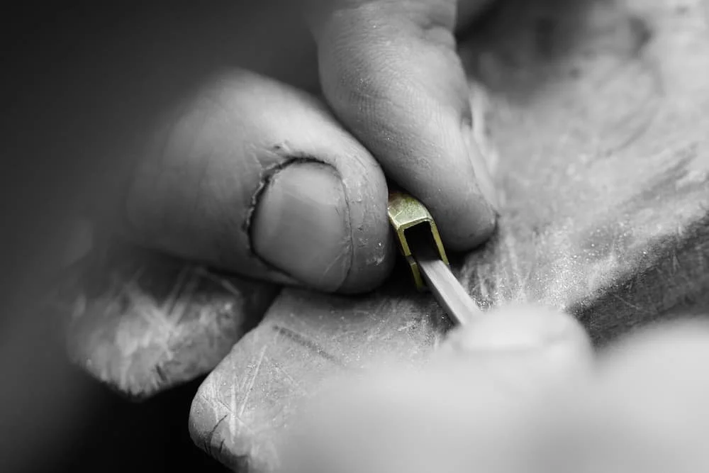 Close-up of a jeweller manufacturing a small item