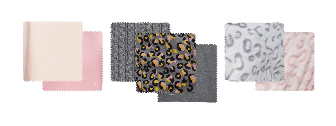 Six pieces of fabric with different patterns and colors, including solid pink, black and pink leopard print, gray with black texture, gray leopard print, and light pink with embossed patterns.