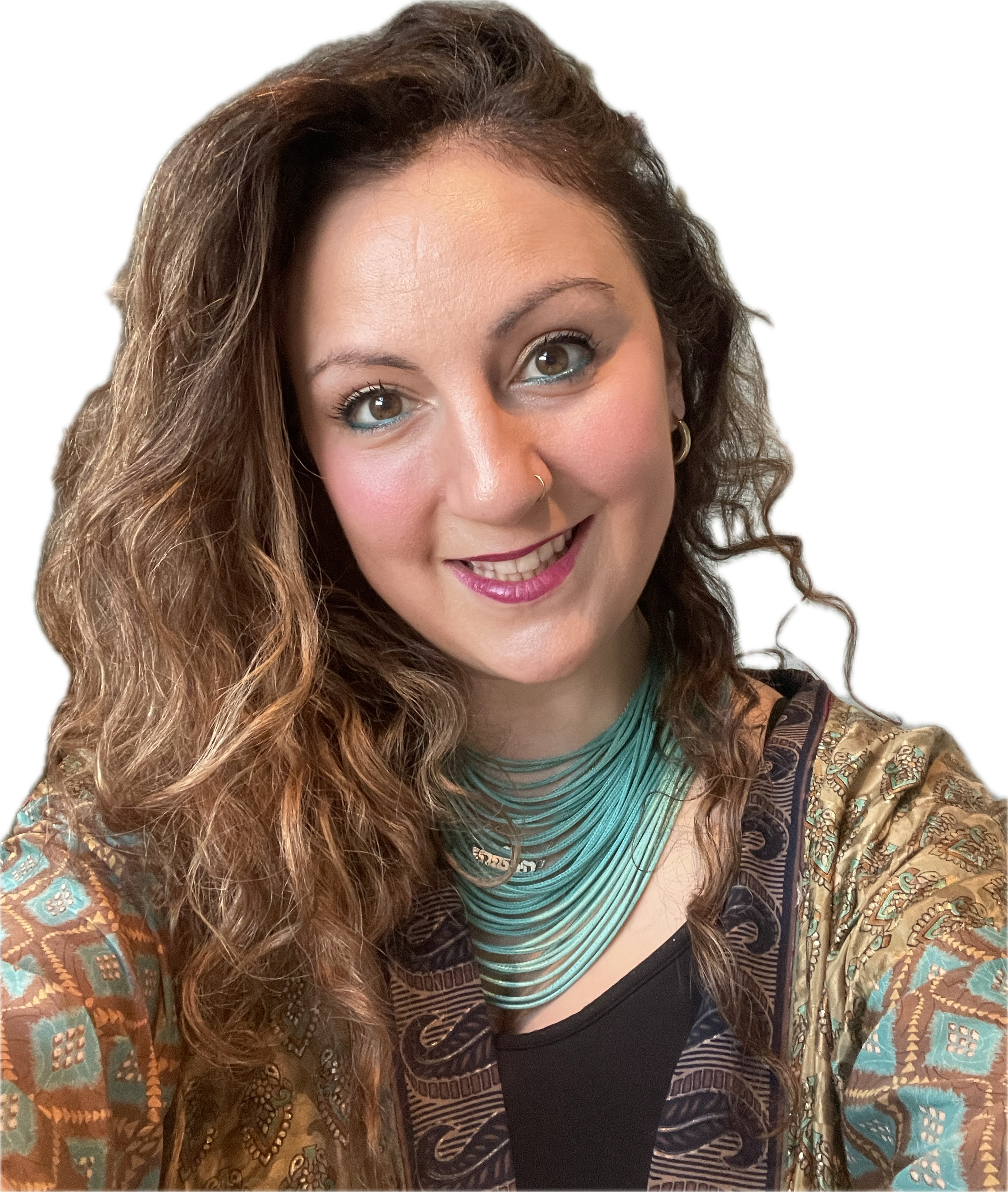 A woman with long, wavy brown hair and brown eyes is smiling and looking slightly upward. She is wearing a patterned jacket, a teal and black striped shirt, and a silver necklace.