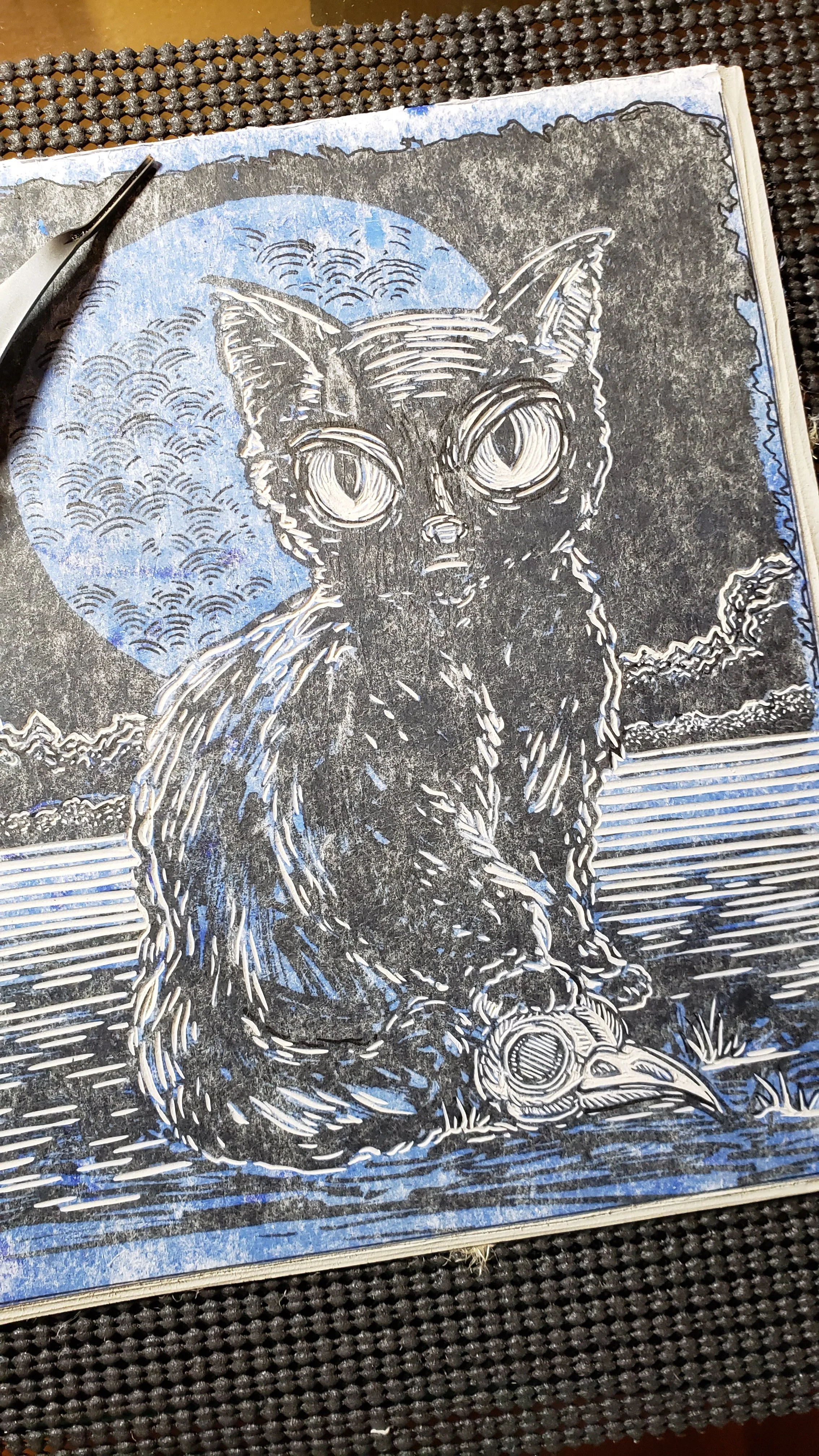 process picture of linocut block partially carved