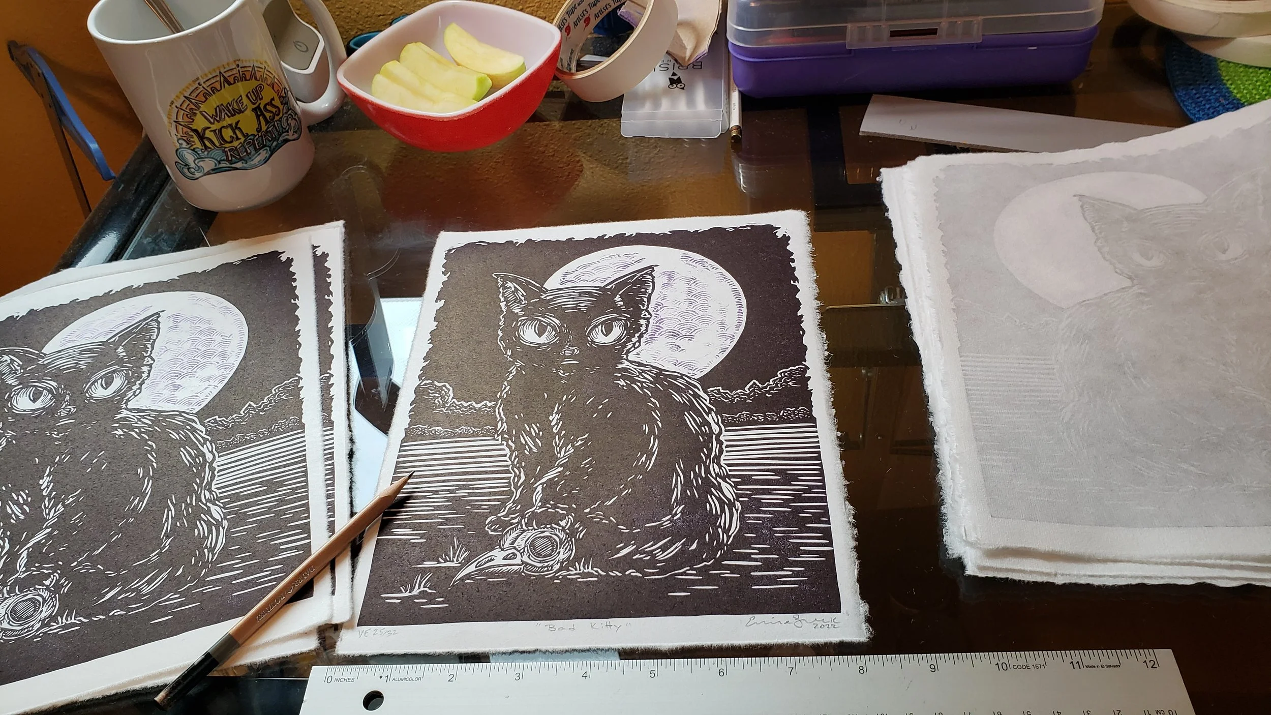 artist's desk set up during signing of "Bad Kitty" print