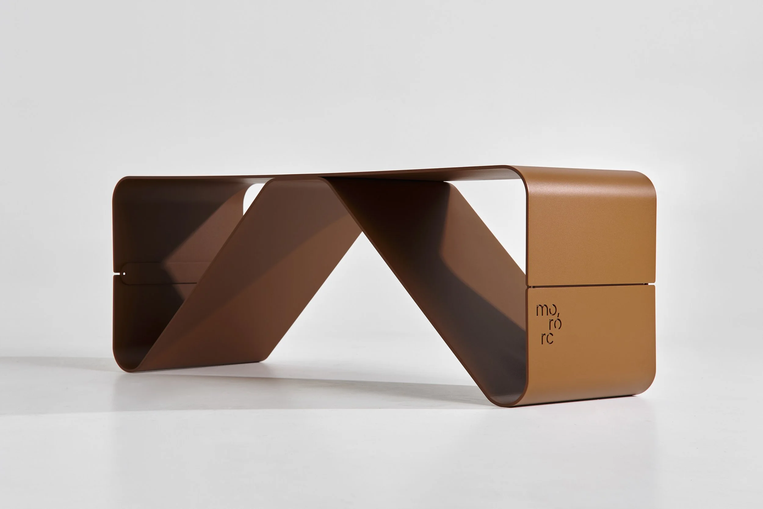 Modern brown modular table with a unique curved design, made from metal or plastic, on a white background.