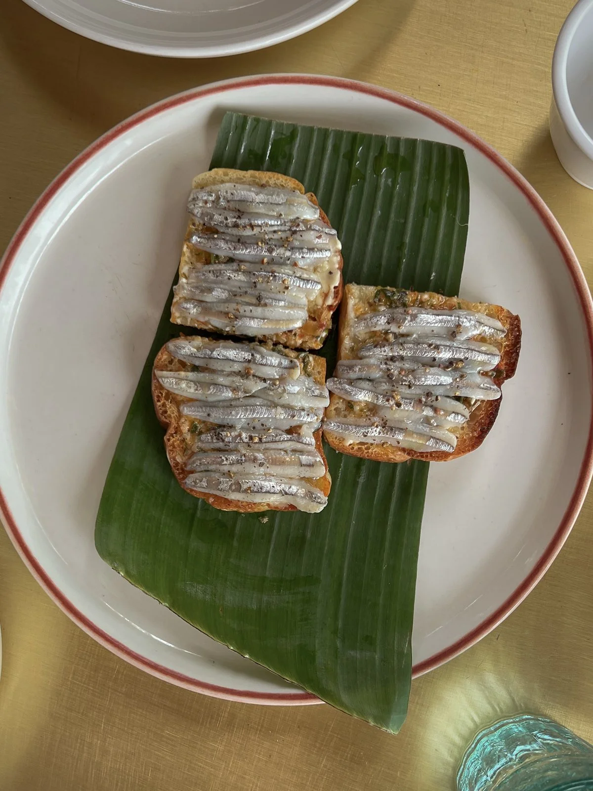 Anchovy toast served on a banana leaf at Mango Rooms, Hoi An, Vietnam