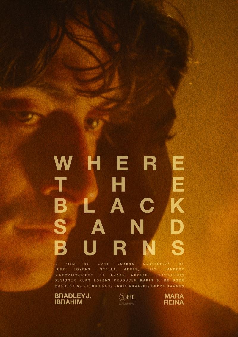 Close-up of a person's face with curly hair, looking at the camera, with warm lighting. Overlaid text reads 'WHERE THE BLACK SAND BURNS' and details about a film's production team.