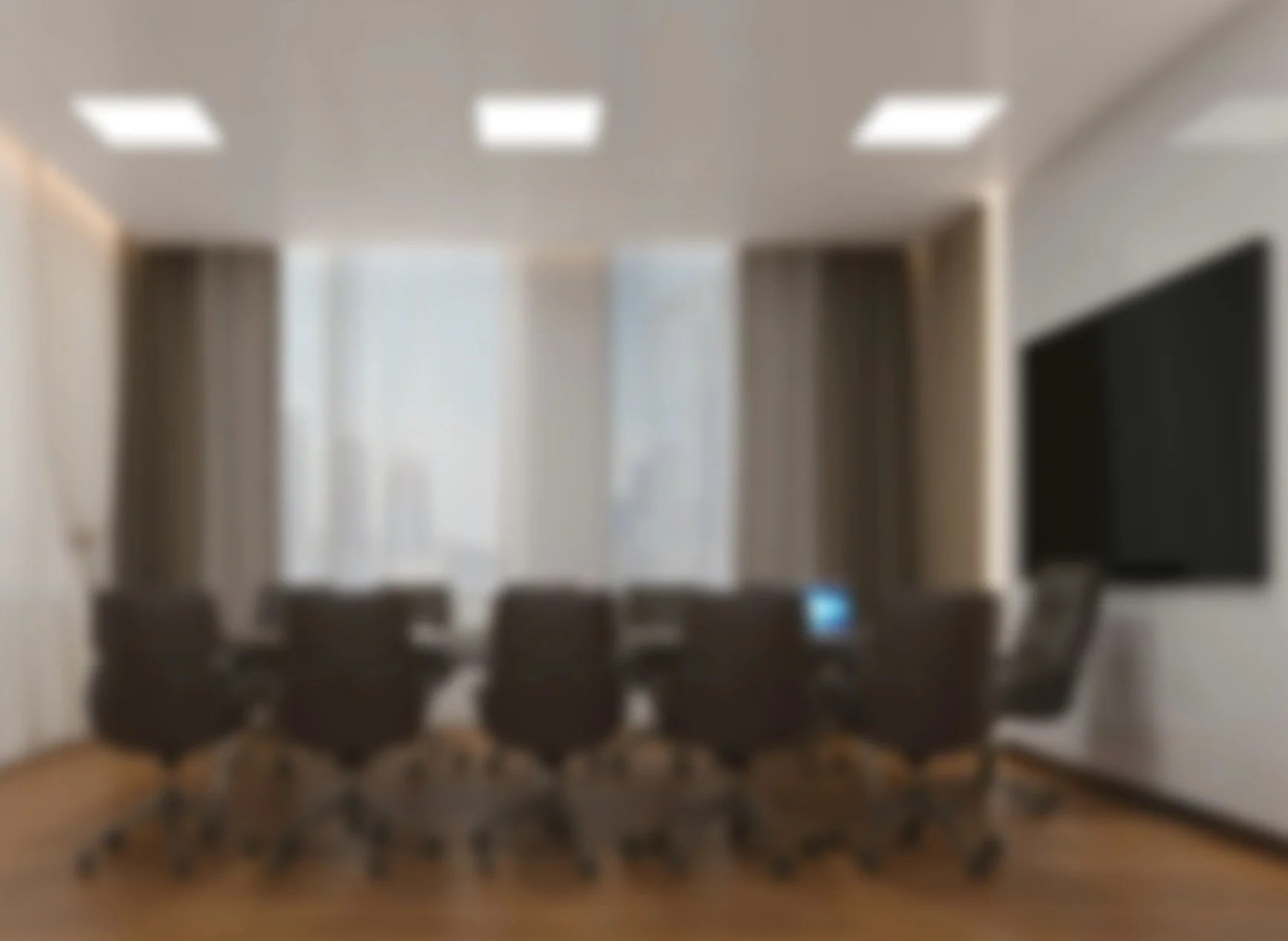 Blurred image of a modern conference room with a long table, office chairs, a wall-mounted television, and large windows with curtains.