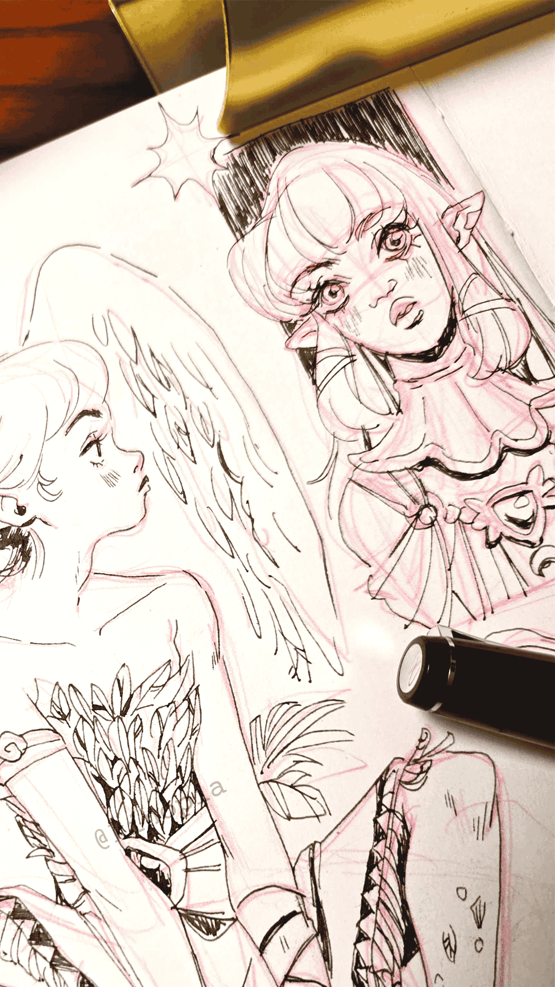 Sketches of two anime-style female characters, one with elf-like ears, winking with a playful expression, the other with long hair, looking thoughtful. There is a black marker pen and some leaves drawn on the sketches.
