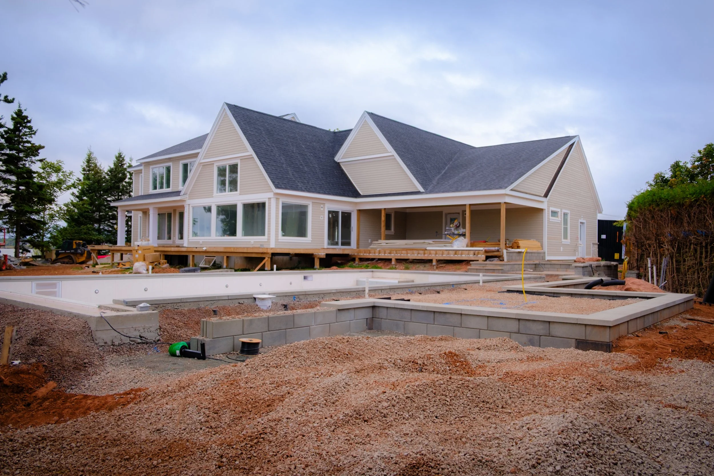 project photo during construction with retaining walls a pool and gravel