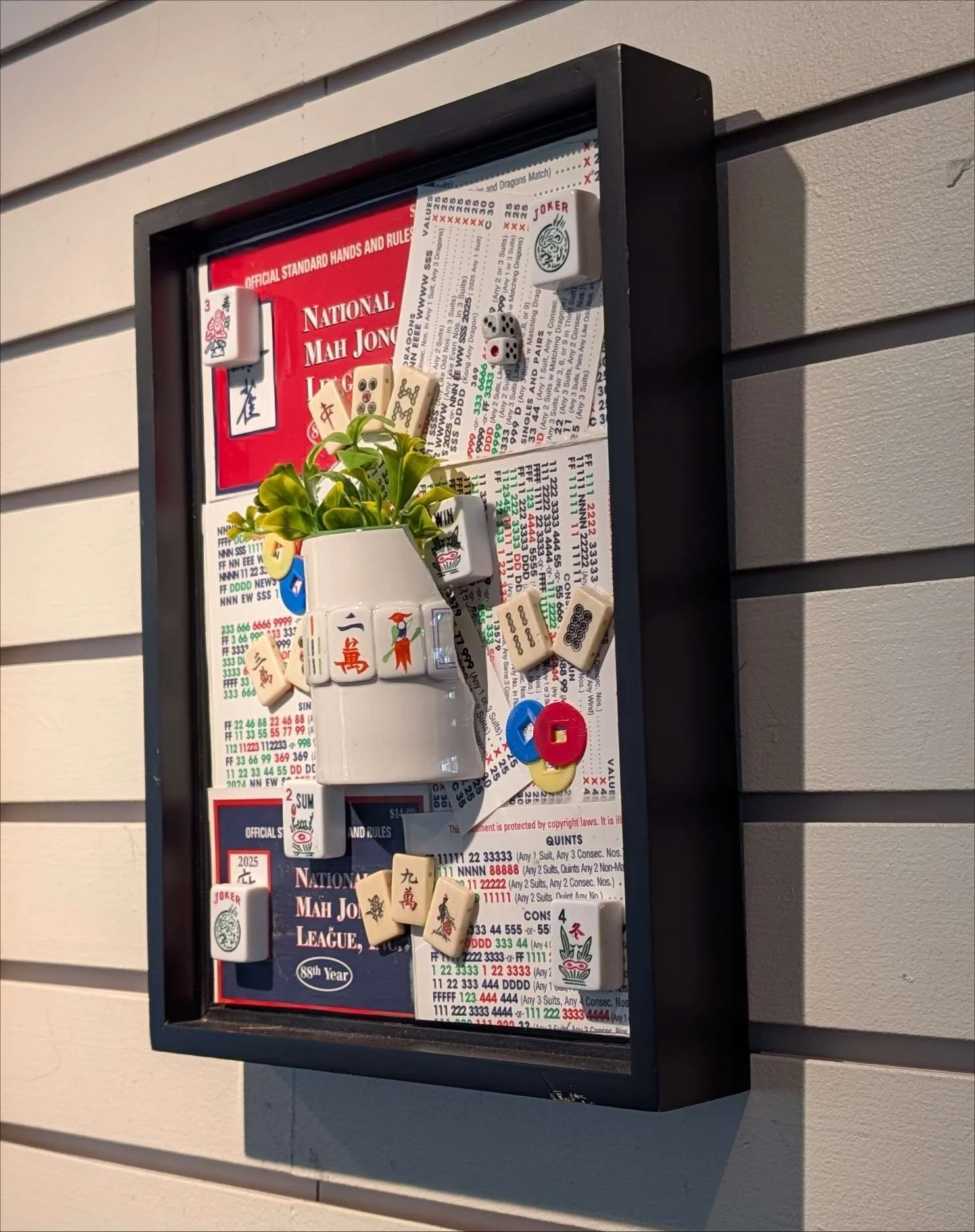 Mah Jongg at Play is a handcrafted assemblage celebrating the game, created by Sarasota, Florida, artist Debra Rich-on wall-right