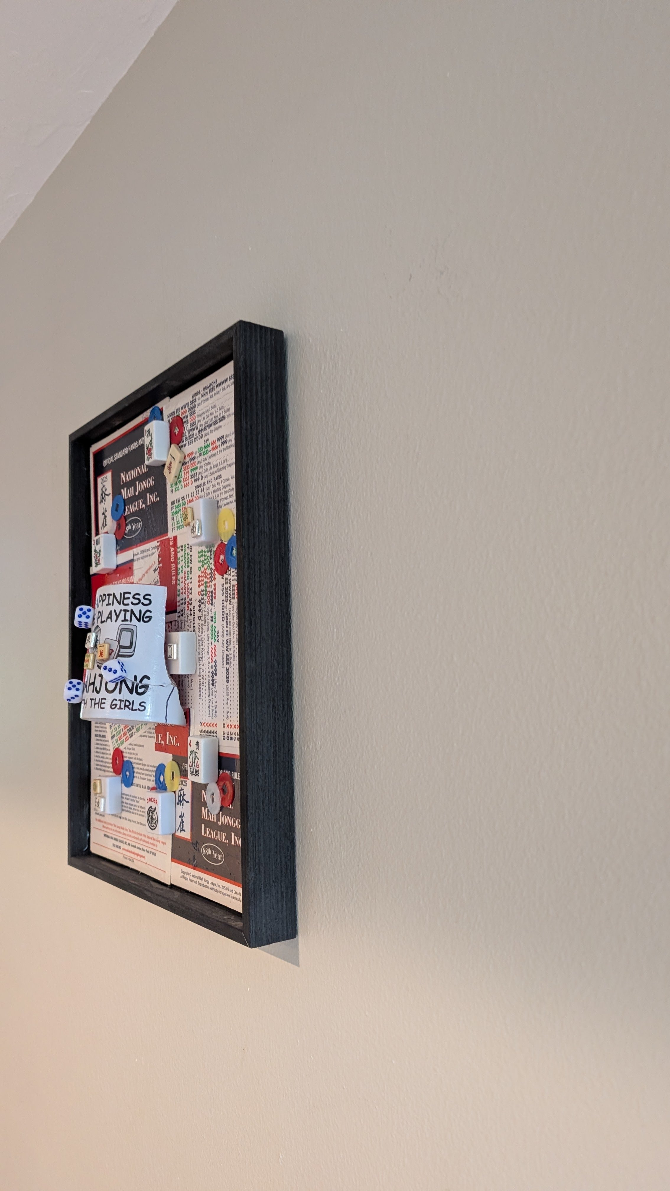 Mah Jongg at Play is a handcrafted assemblage celebrating the game, created by Sarasota, Florida, artist Debra Rich-on wall-right