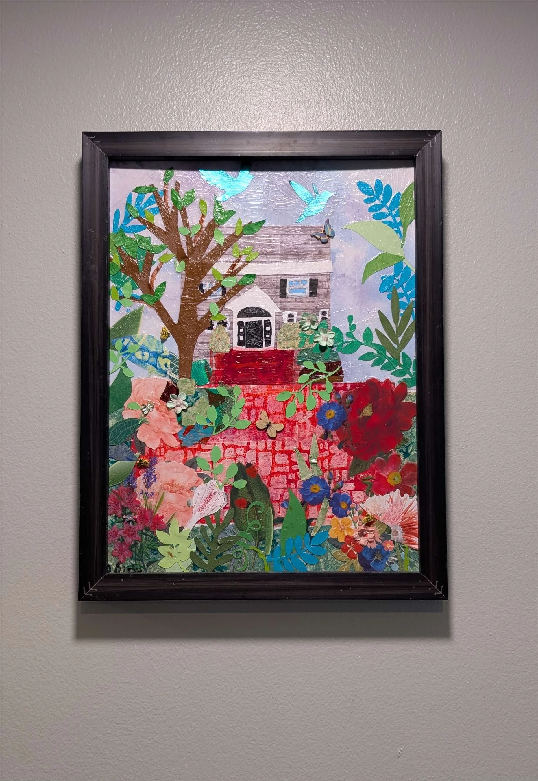 Vibrant 13.5x17.5" handcrafted collage of a home surrounded by a garden by Sarasota Artist, Debra Rich-on-wall