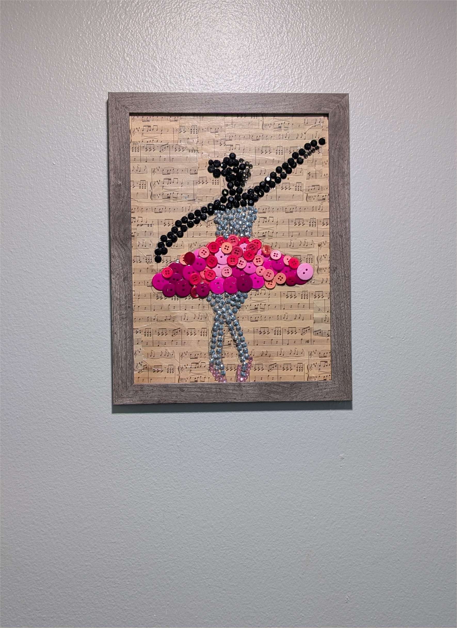 Graceful Ballet Dancer Button Art by Sarasota Florida artist, Debra Rich — framed assemblage displayed on wall