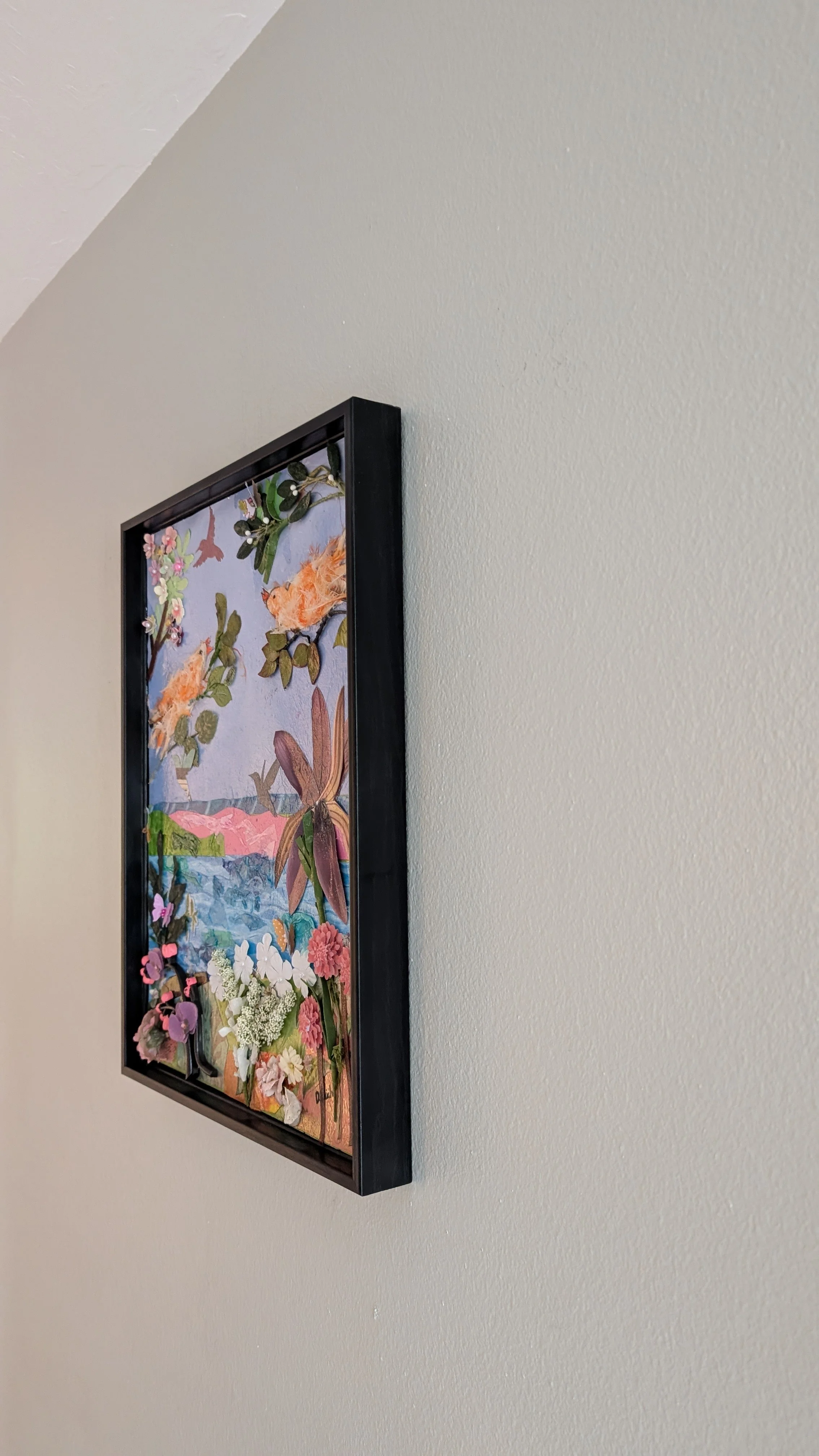 Right side-Mango's Last Stand mixed-media memorial collage — two orange canaries made from real feathers in layered paper garden, by Debra Rich