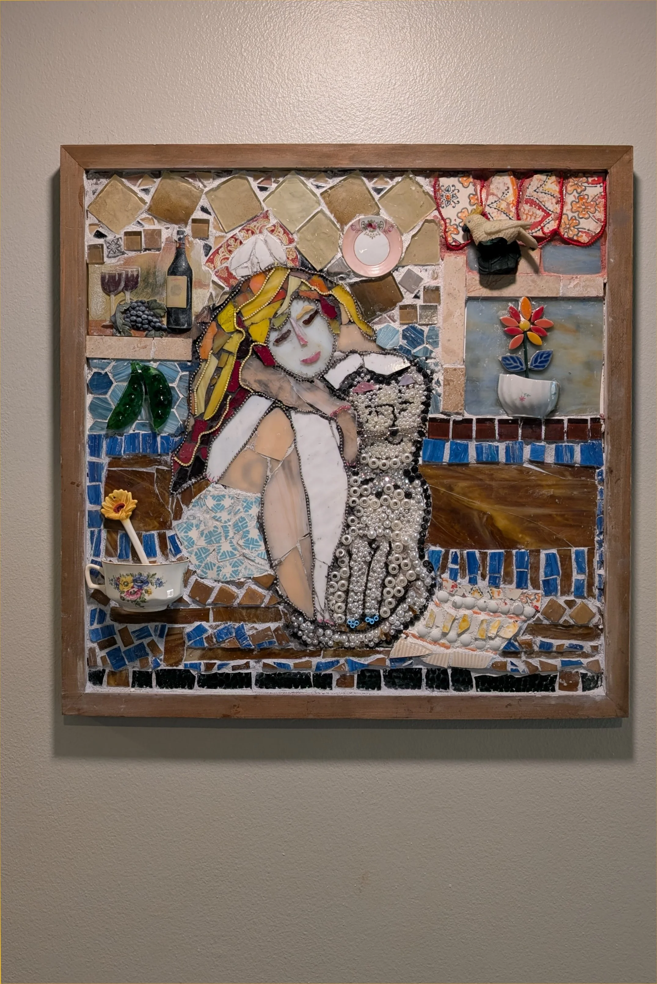 Relaxin' with the Cat mosaic assemblage art by Debra Rich — woman and cat portrait made with tile, glass, and pearls-on wall