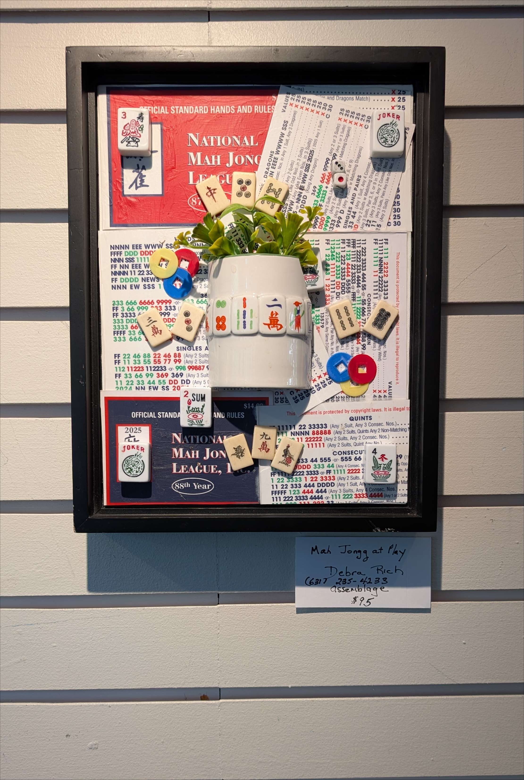 Mah Jongg at Play is a handcrafted assemblage celebrating the game, created by Sarasota, Florida, artist Debra Rich-on wall