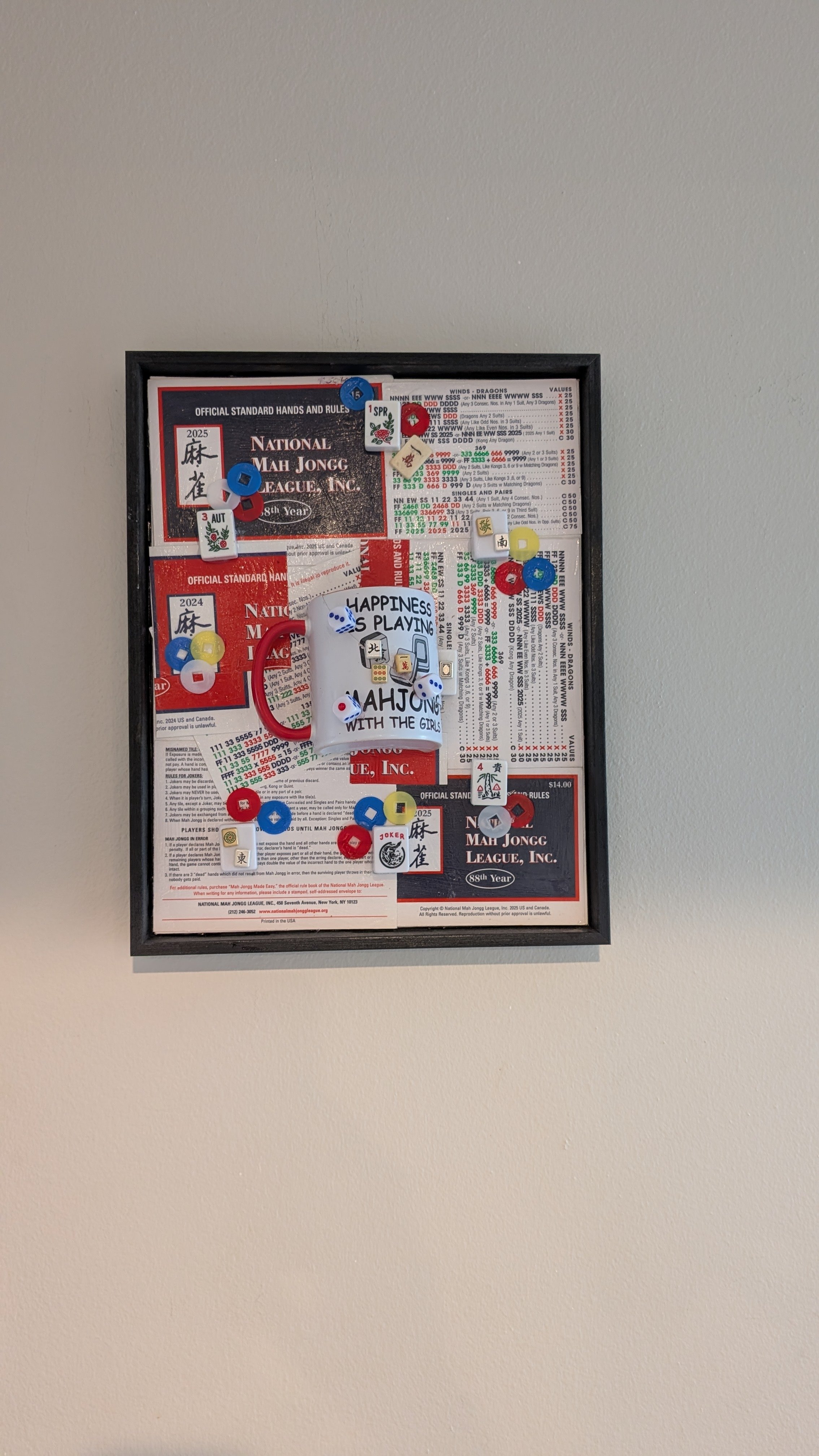 Mah Jongg at Play is a handcrafted assemblage celebrating the game, created by Sarasota, Florida, artist Debra Rich-on wall