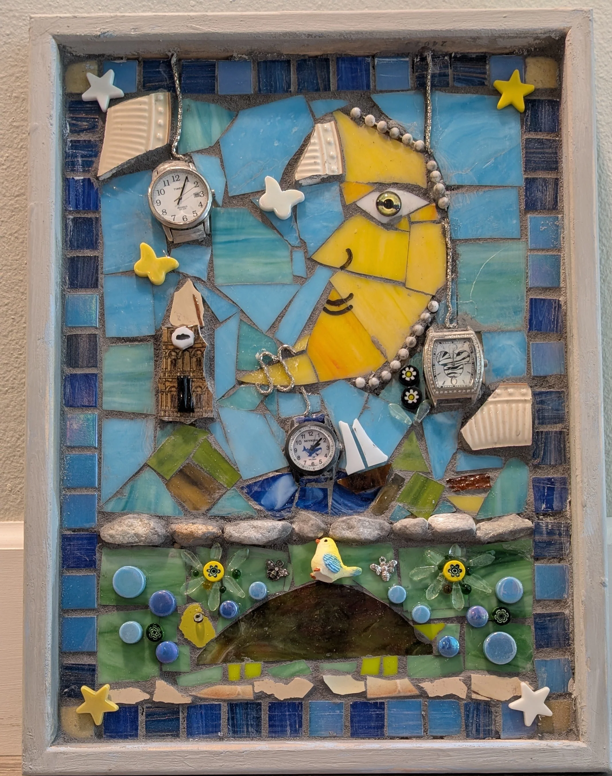 Handcrafted assemblage combining moon imagery with clock and timepiece elements in vibrant colors