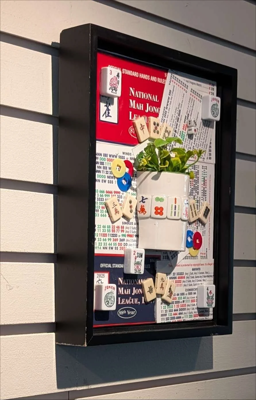 Mah Jongg at Play is a handcrafted assemblage celebrating the game, created by Sarasota, Florida, artist Debra Rich-on wall-left