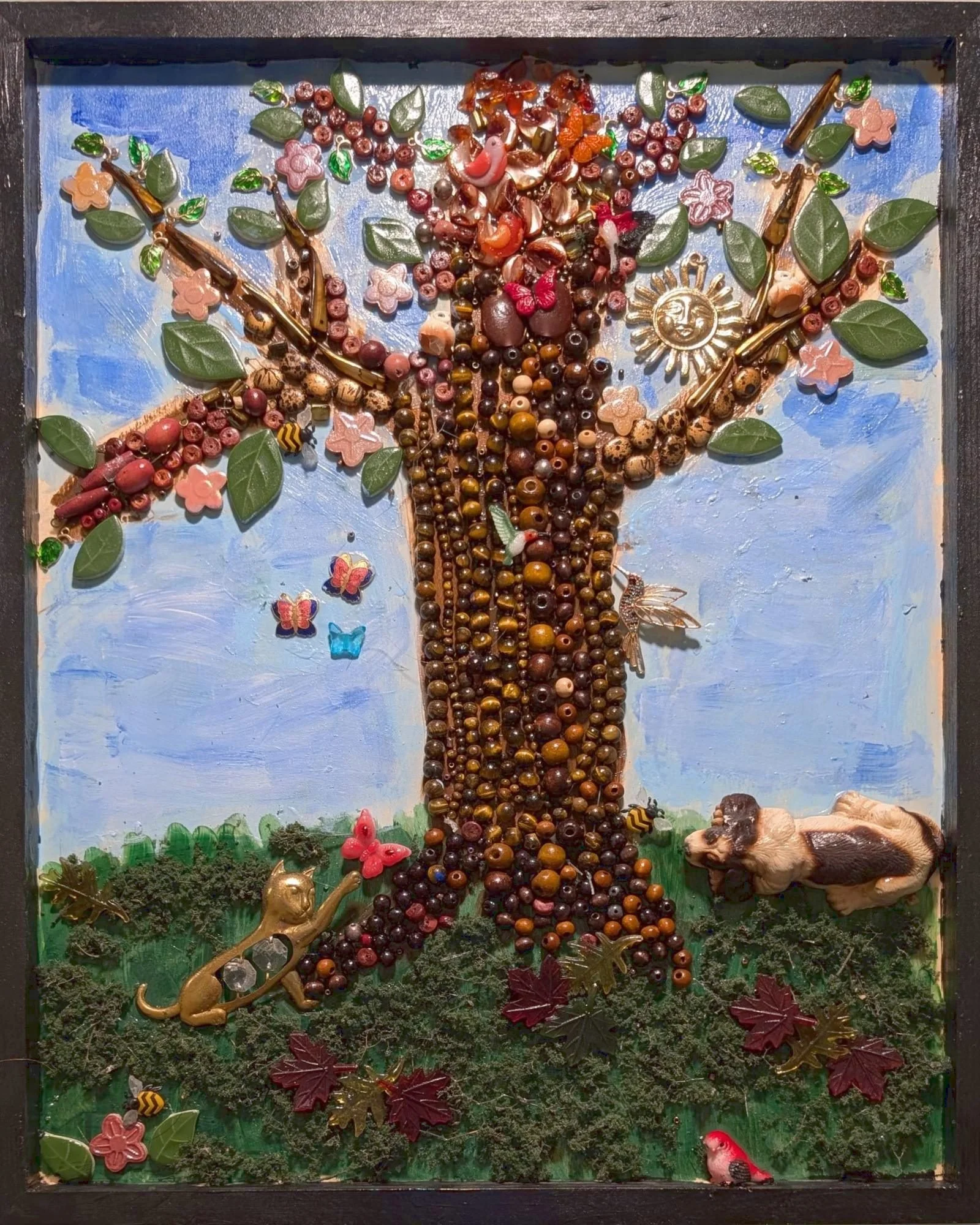 The Last Tree assemblage by Debra Rich: beaded tree trunk, mosaic tile leaves, fused-glass birds, pin sun and cat, black frame