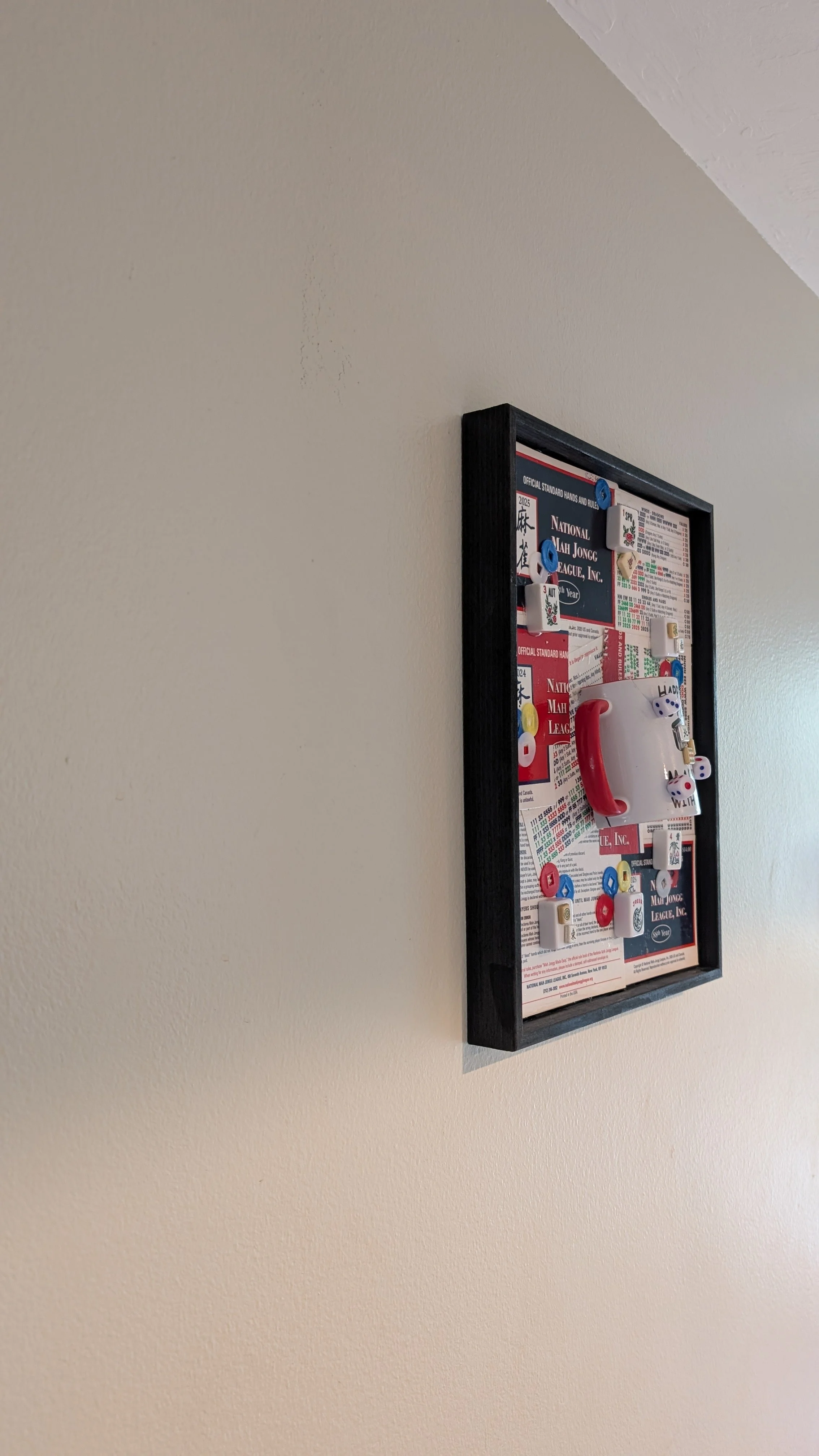 Mah Jongg at Play is a handcrafted assemblage celebrating the game, created by Sarasota, Florida, artist Debra Rich-on wall-left