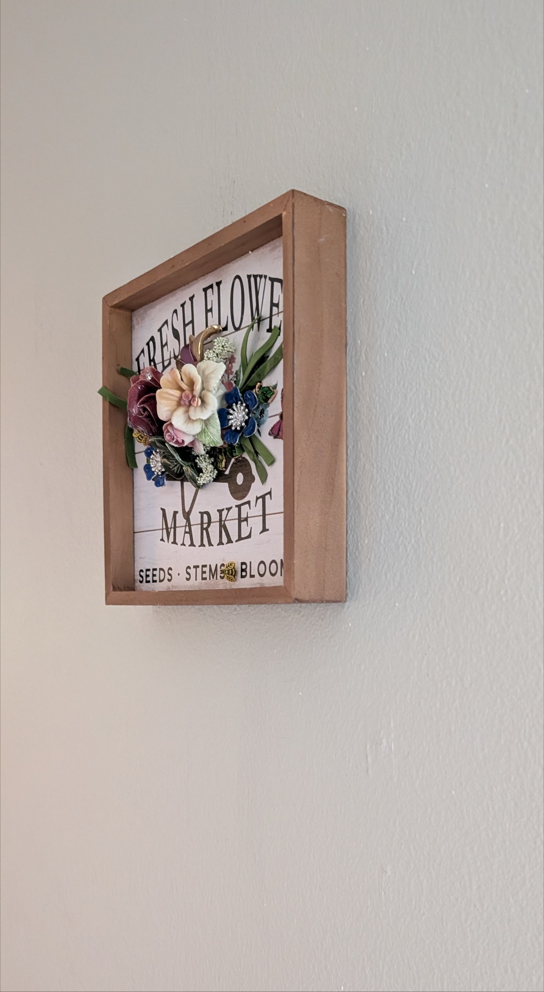 Right side view of Fresh Flower Market assemblage by Debra Rich showing 2.5 inch shadow box depth and raised 3D floral elements