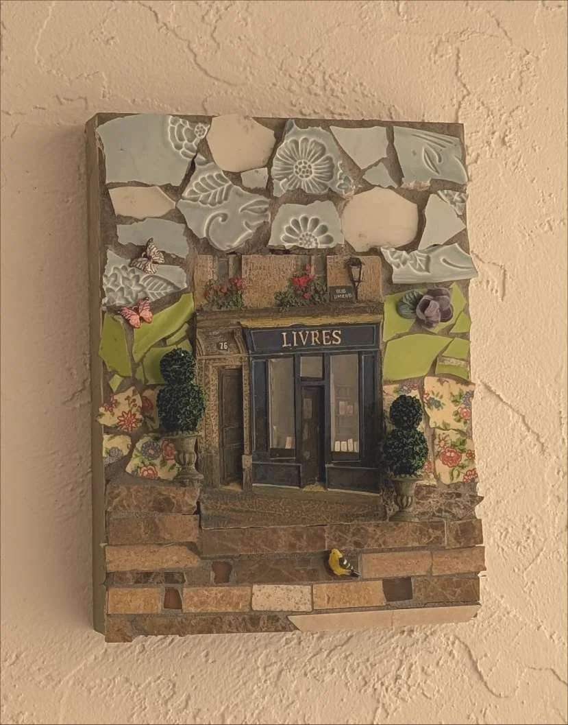 Handcrafted ceramic mosaic of a charming French bookstore facade, by Debbie Rich - on a Wall