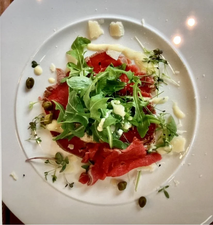 Carpaccio of Beef with anchovy, lemon & parmesan drizzle