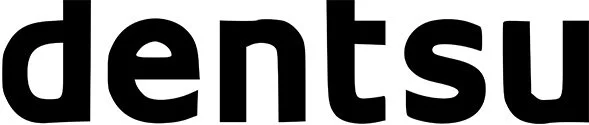 Close-up of the word 'Dentsu' in black lowercase letters on a white background.