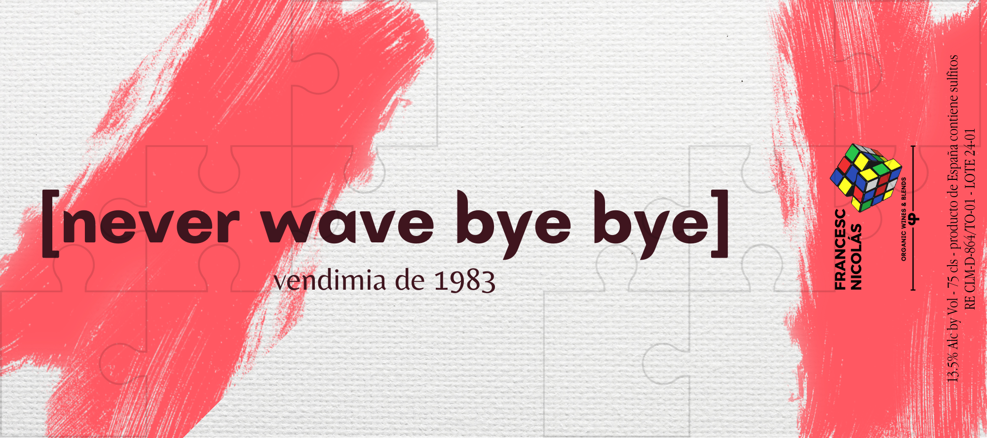 Etiqueta de vino con fondo grisáceo y detalles en rojo y blanco, con imagen de un rompecabezas y texto en inglés y español.
