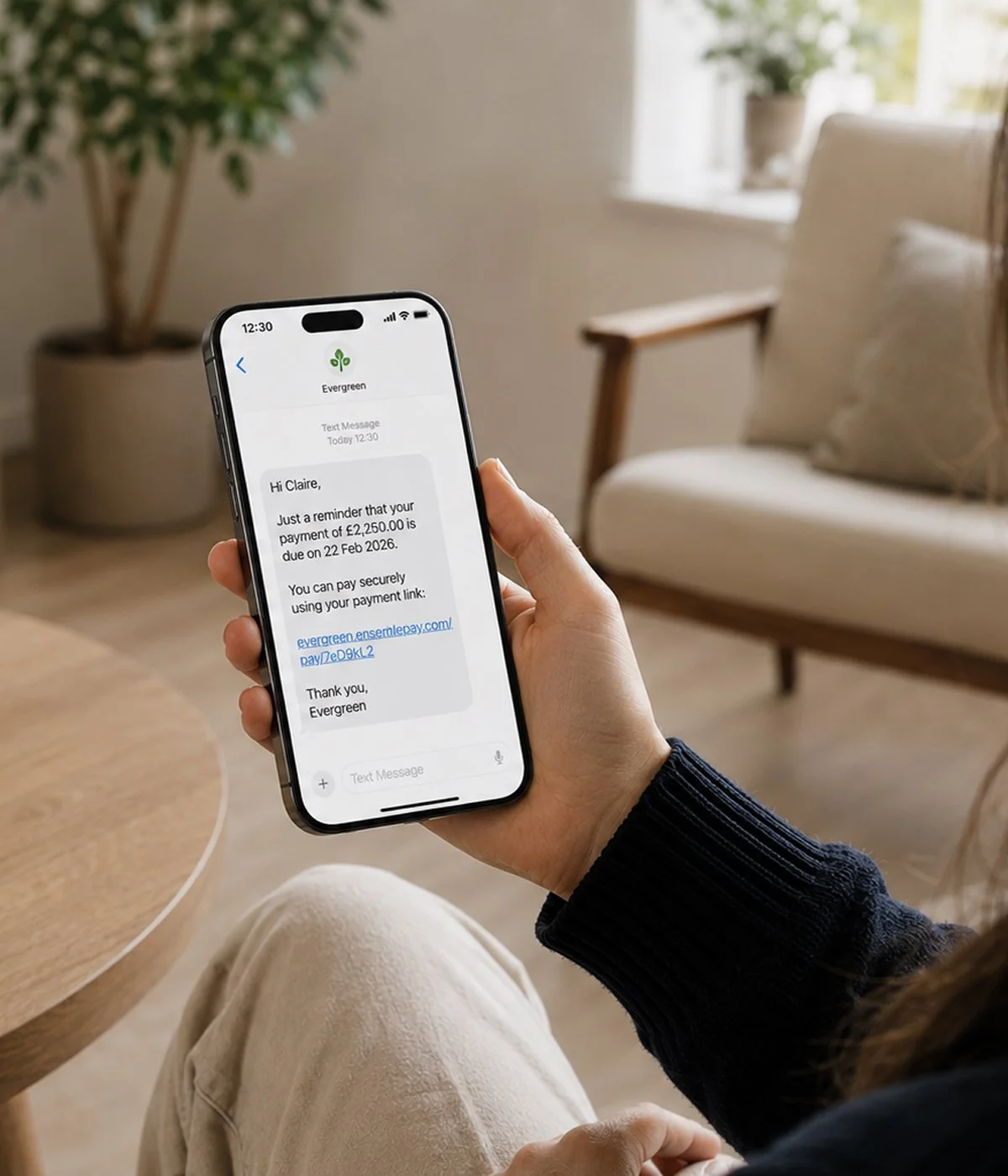 Person holding phone looking at a text message.jpg