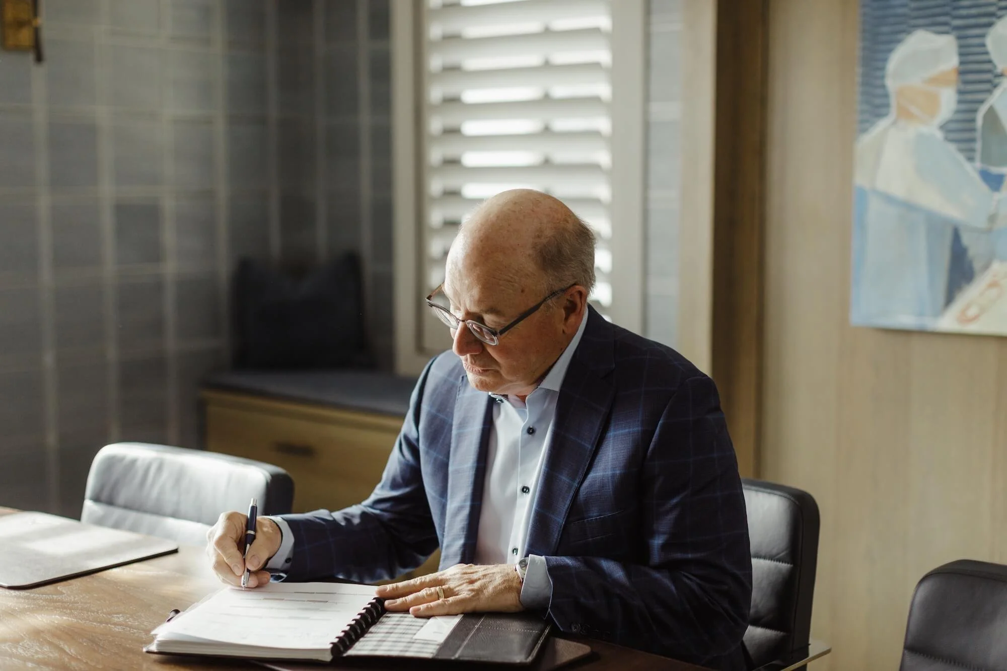 Bill Boer works at his desk.
