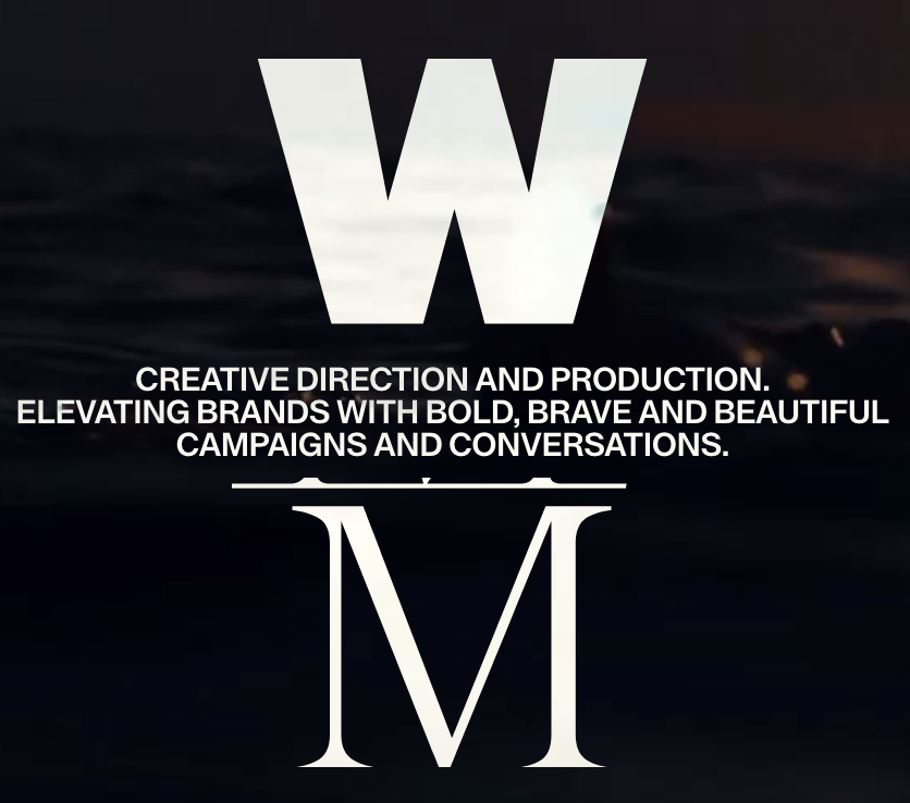A promotional poster with large white letters 'W' and 'M', featuring text about creative direction and branding, set against a dark, abstract background.