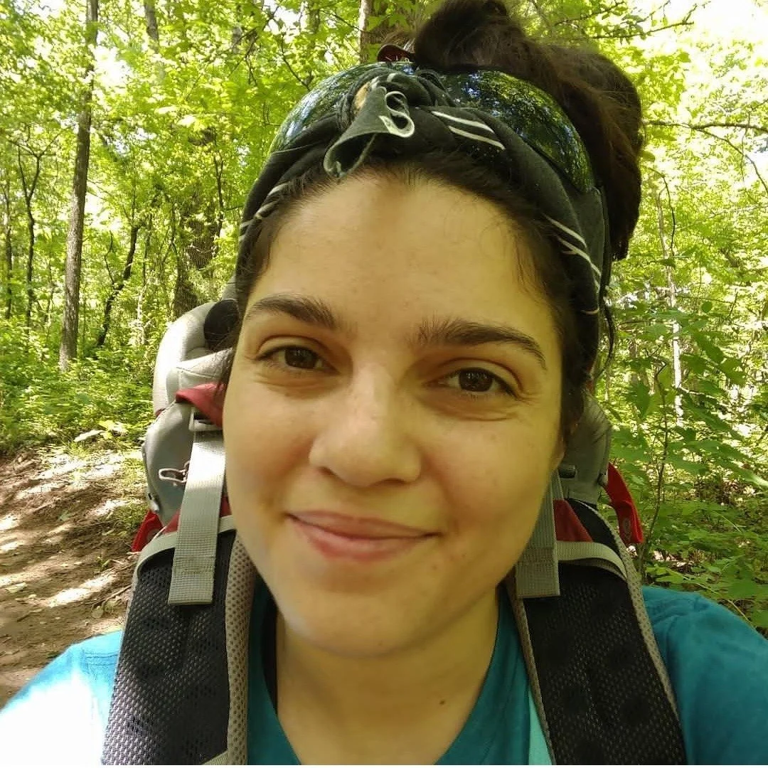 headshot of Melissa in the woods