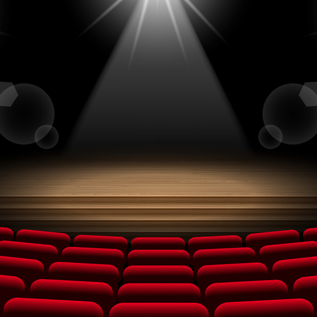 Empty theatre stage with spotlight and red seats ready for a live performance.