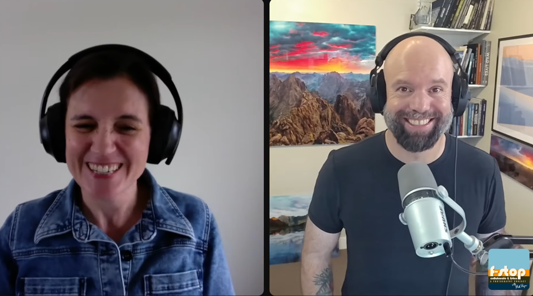 Two people, a woman on the left and a man on the right, wearing headphones during a video call or podcast. The woman has short dark hair, is smiling, and wearing a denim jacket. The man is bald with a beard, smiling, wearing a black t-shirt, and is seated in front of a colorful landscape painting with a mountain scene, and a bookshelf behind him. The man is speaking into a microphone.