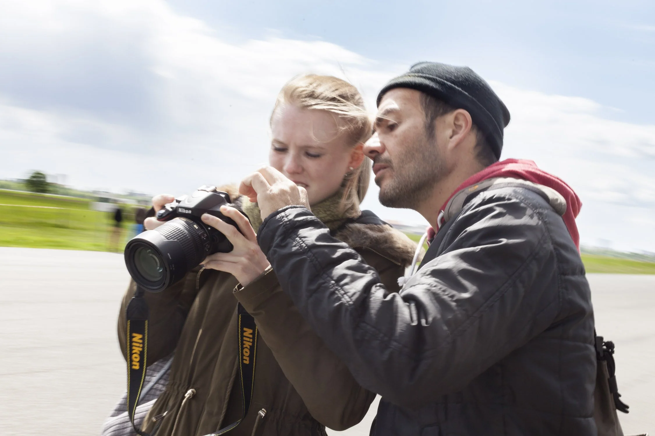 Photography workshop with instructor giving feedback