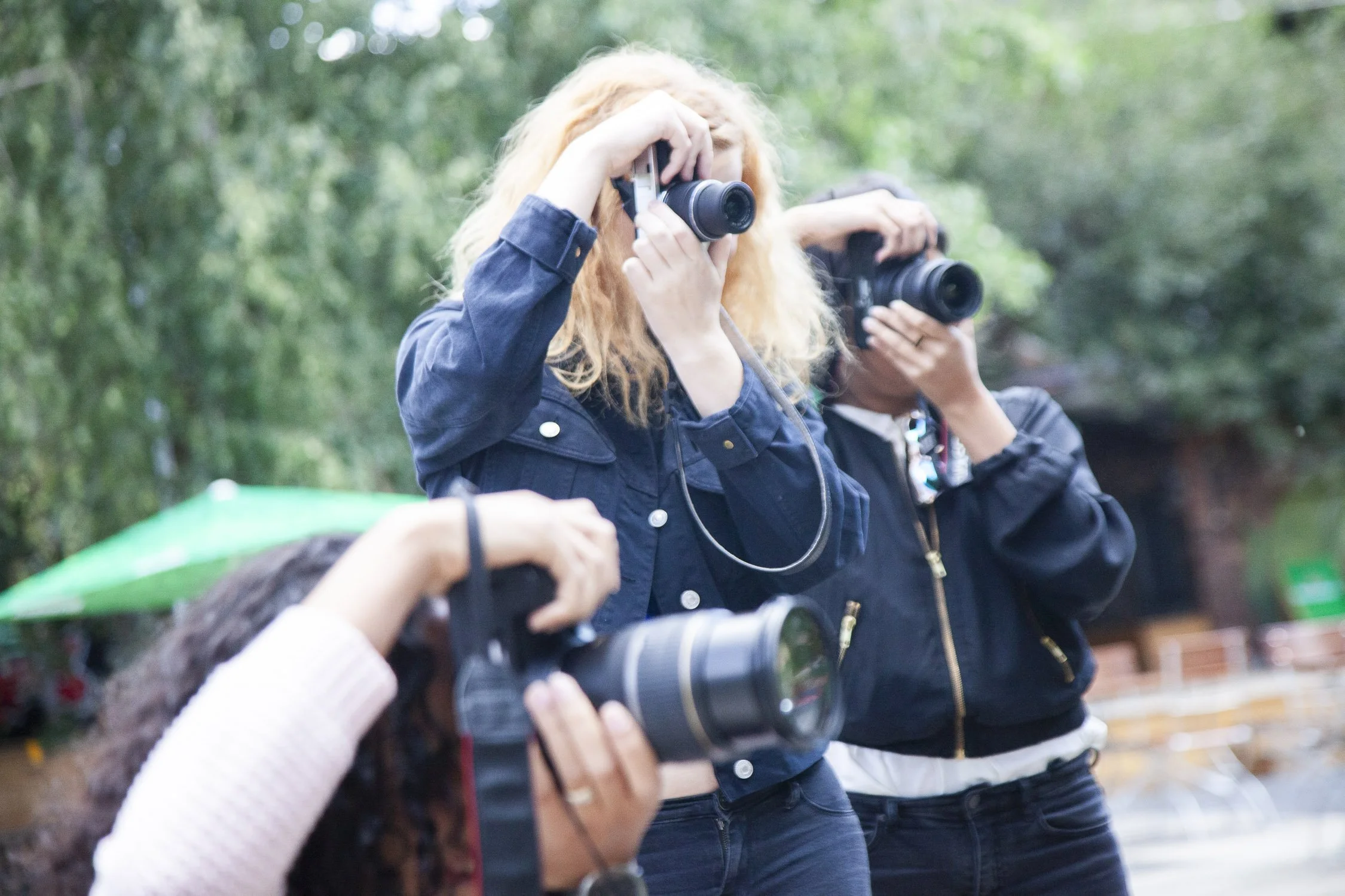 Photography workshop with small group learning exposure