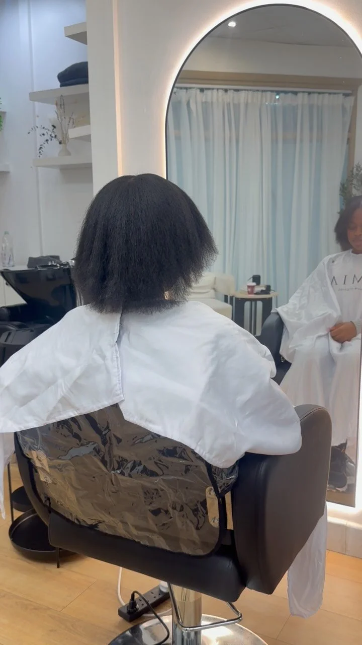 Natural hair, washed and stretched, in the chair at AMIA