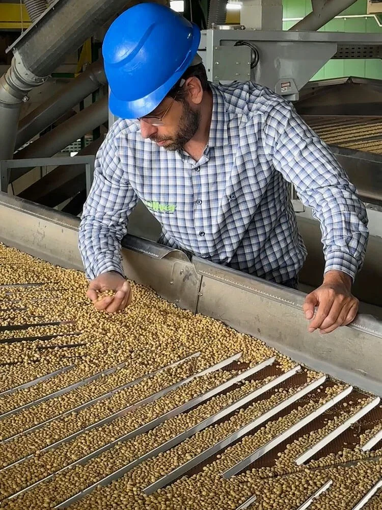 Oliver technician providing on-site equipment support and operator training at a processing facility
