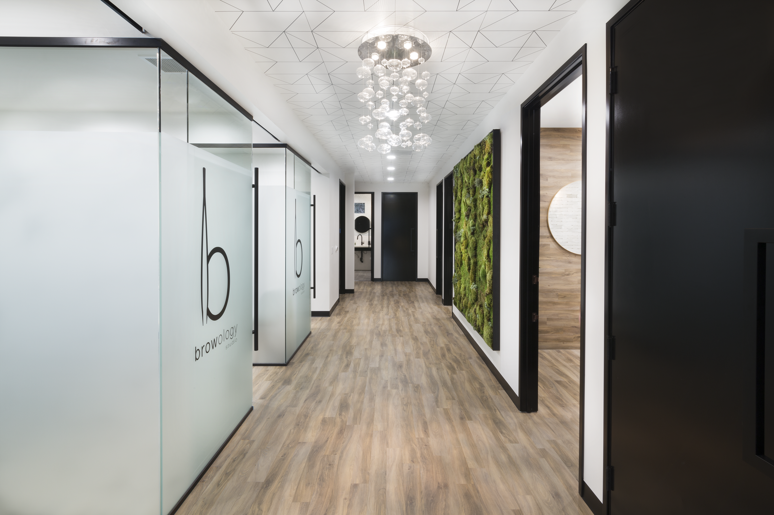 Med Spa corridor with wood floor and glass partitions