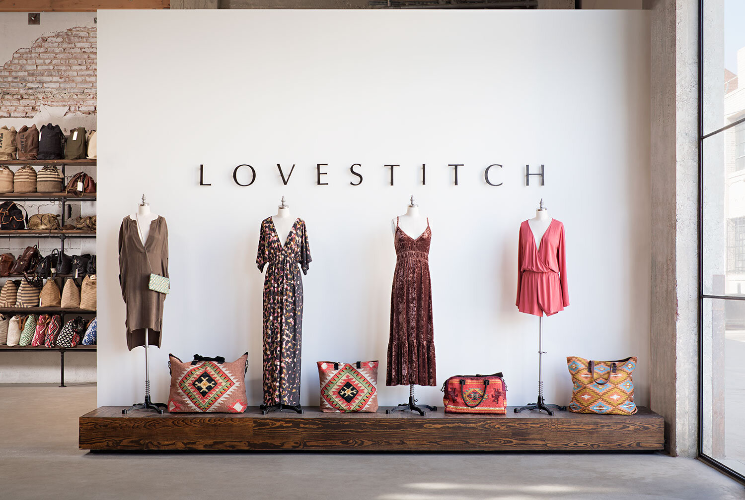 A clean, contemporary mannequin display within a women's clothing store.