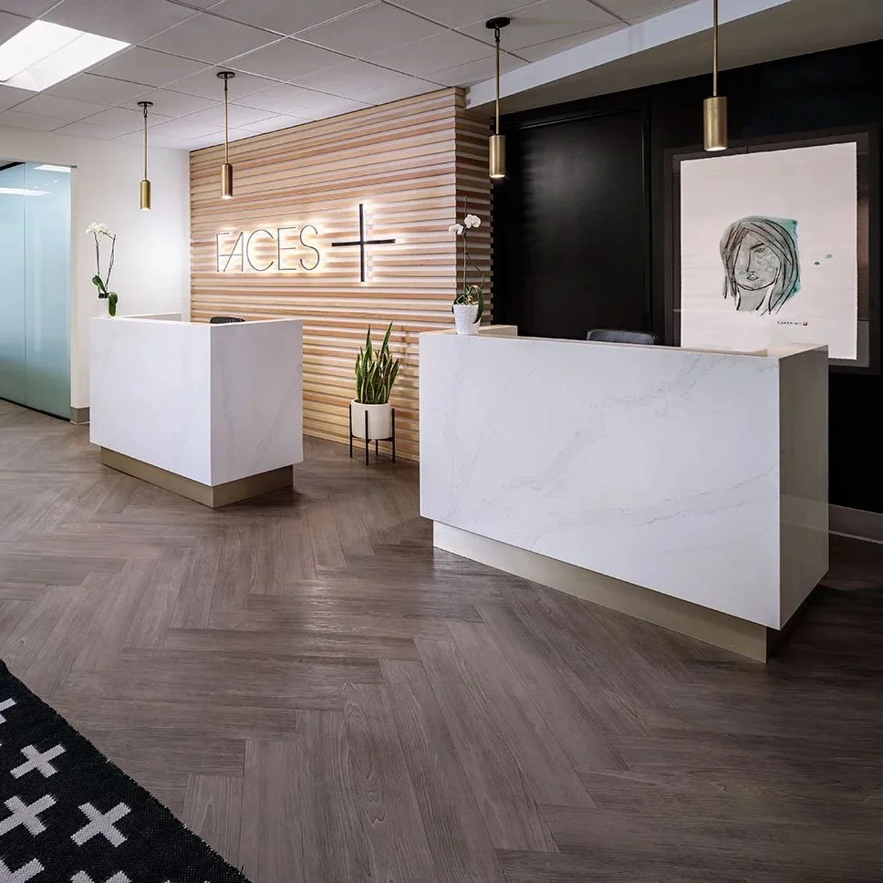 Hotel inspired reception desks at a doctor's office