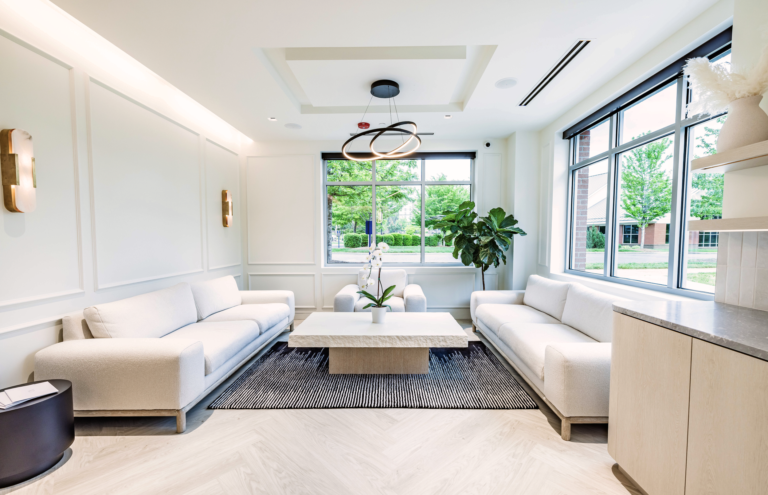 A hospitality inspired wating area at a docto's office.