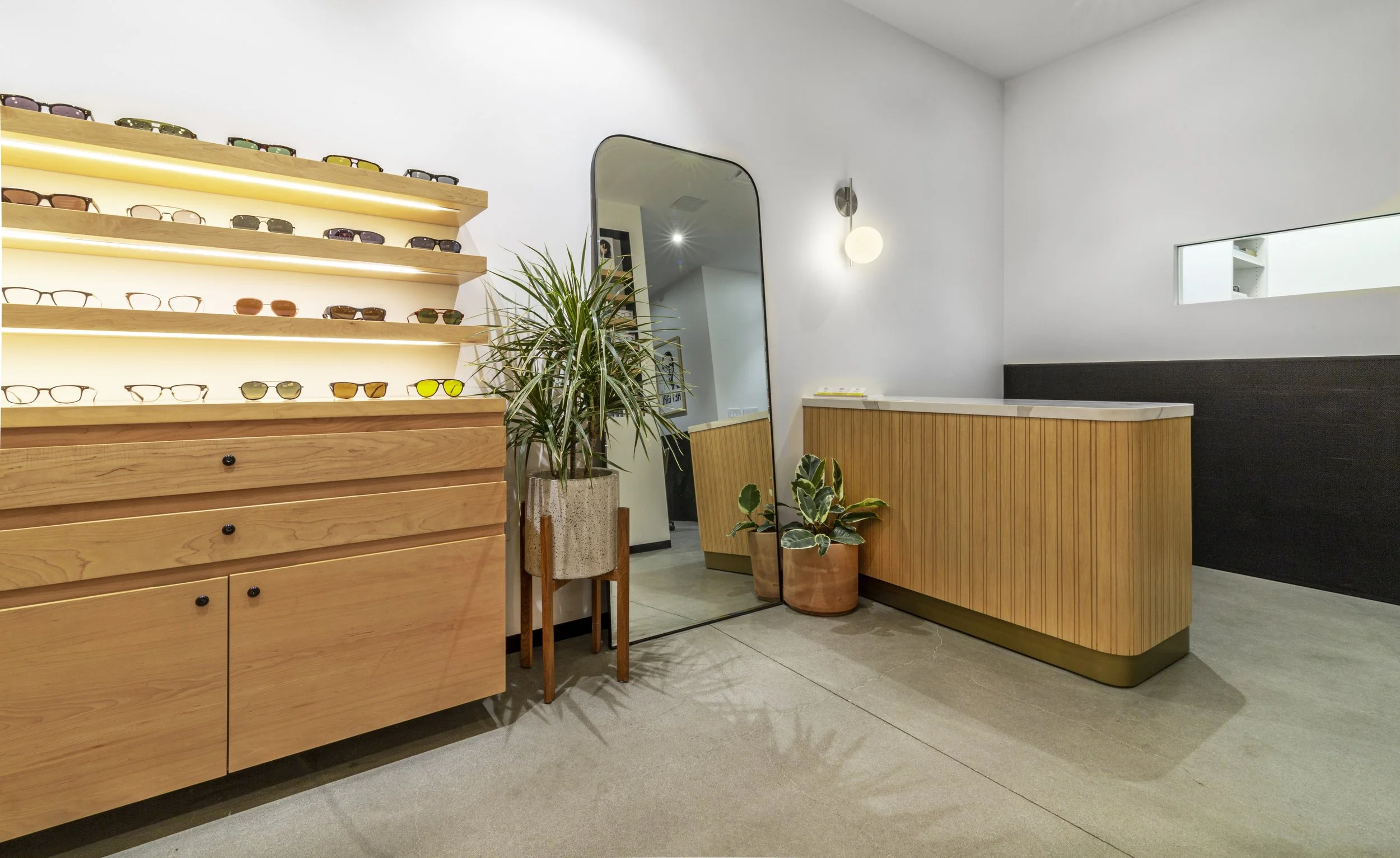 contemporary check-out desk and retail optical display 