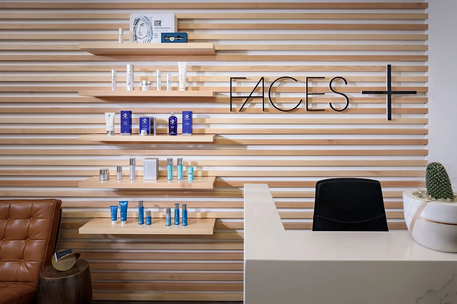 A hospitality inspired retail check out area for a med spa within a plastic surgeons office.