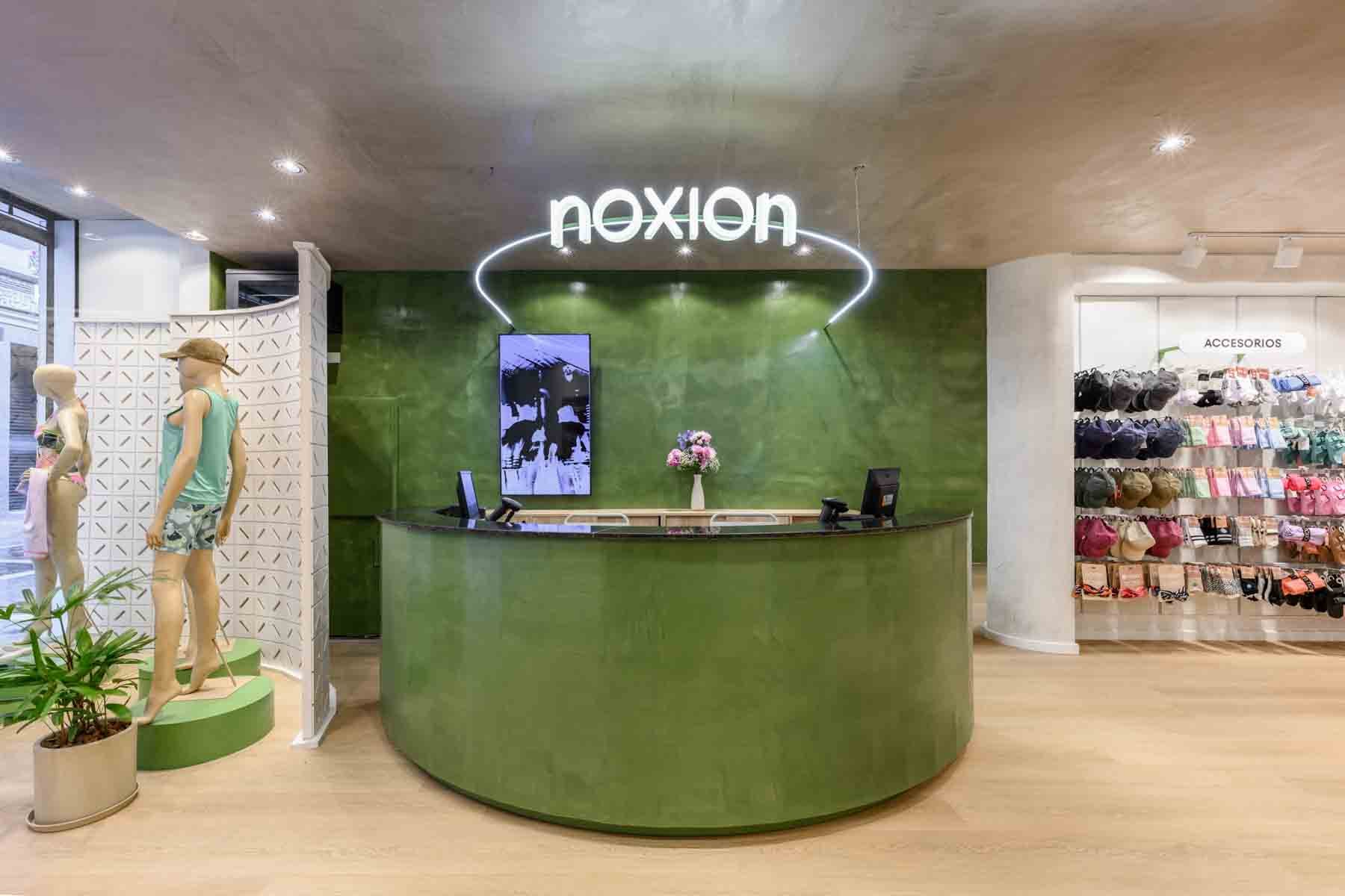 Green cash wrap and accent wall with neon signage